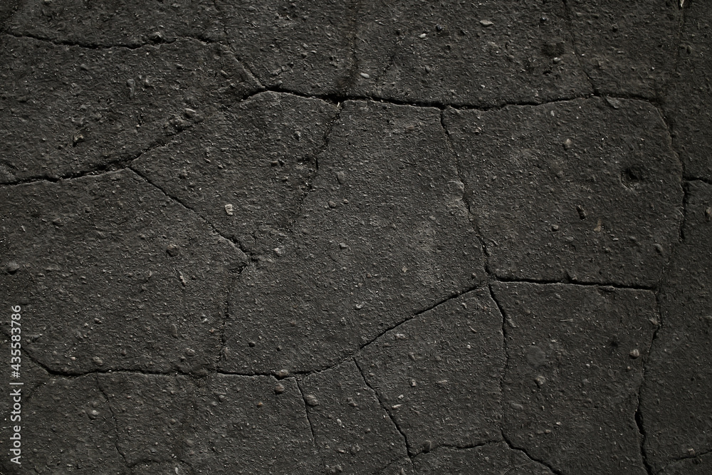 Obraz premium asphalt in cracks texture / abstract background cracks on asphalt road