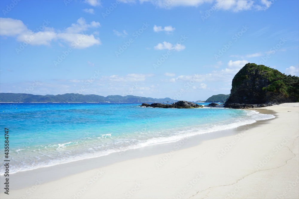 Beautiful summer scenery. calm waves on the blue water. Furuzamami Beach in Zamami island, Okinawa, Japan - 日本 沖縄 座間味島 古座間味ビーチ 青い海 Beautiful summer scenery. calm waves on the blue water. Furuzamami Beach in Zamami island, Okinawa, Japan - 日本 沖縄 座間味島 古座間味ビーチ 青い海