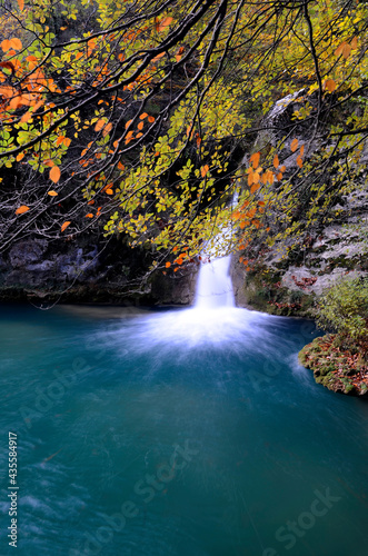 Waterfall and pool in the river. Urederra River Natural Reserve. Navarre. Spain