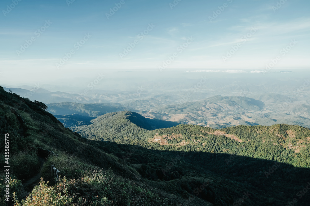 Obraz premium beautiful blue sky high peak mountains green forest guiding for backpacker camping backpacking hiking idea long weekend at Kew Mae Pan Nature Trail Waterfall Doi Inthanon, Chiang Mai, Thailand.
