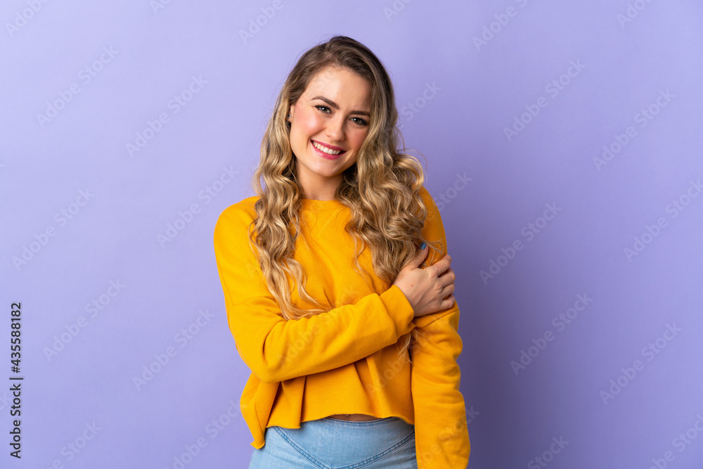 Young Brazilian woman isolated on purple background laughing Young Brazilian woman isolated on purple background laughing