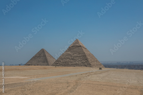The Great Pyramids of Giza near the ruins of a temple in Giza  Egypt