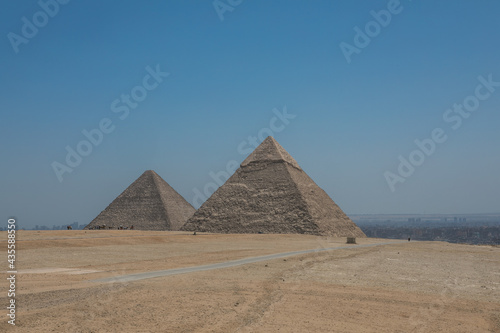 The Great Pyramids of Giza near the ruins of a temple in Giza, Egypt