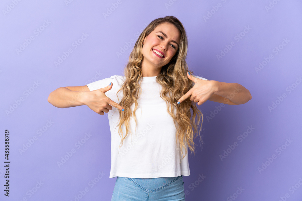 Young Brazilian woman isolated on purple background proud and self-satisfied Young Brazilian woman isolated on purple background proud and self-satisfied