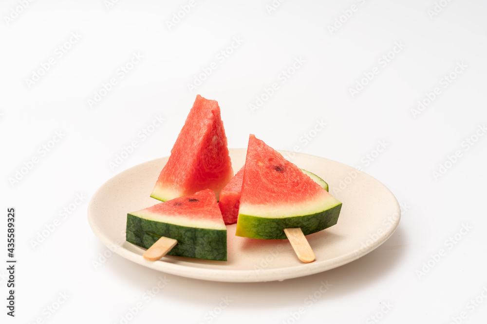 There is watermelon ice cream on the plate