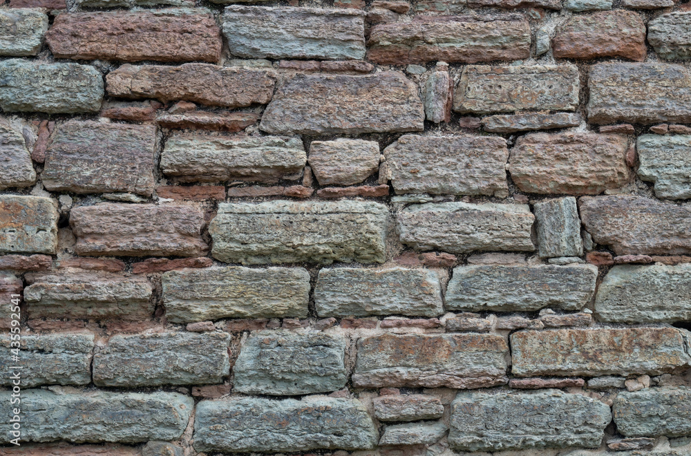 Texture of an old destroyed stone wall from the 17th century.