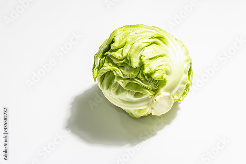 Fresh young cabbage, whole head isolated in white background © FuzullHanum