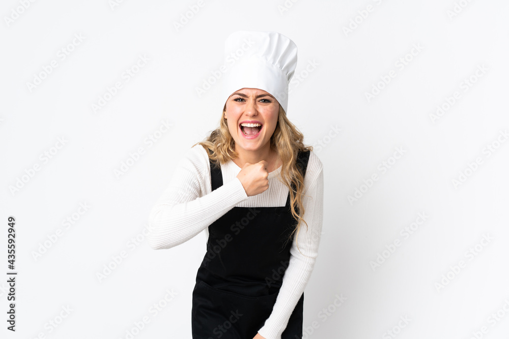 Young Brazilian chef woman isolated on white background celebrating a victory Young Brazilian chef woman isolated on white background celebrating a victory