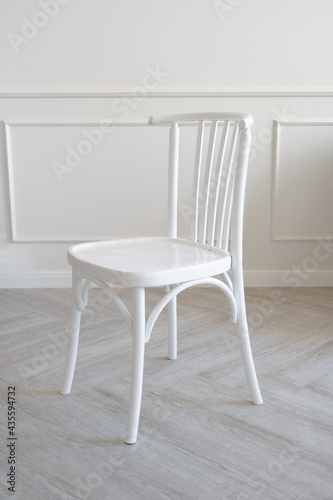 White vintage wooden chair in a light interior