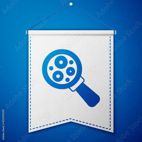 Blue Microorganisms under magnifier icon isolated on blue background. Bacteria and germs, cell cancer, microbe, virus, fungi. White pennant template. Vector