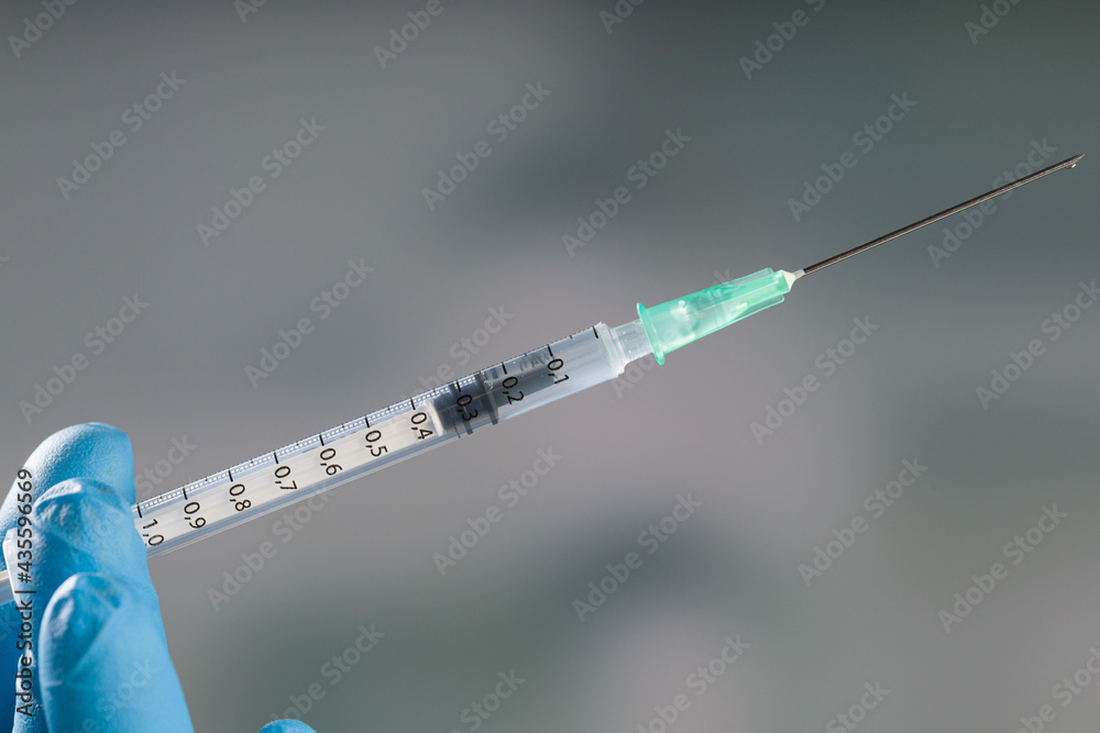 Close up of a syringe with covid-19 vaccine od other vaccine Close up of a syringe with covid-19 vaccine od other vaccine