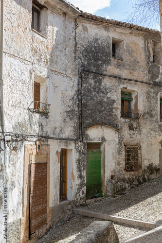 Cobbled street and dilapidated facades of the old town of Bocairent  Valencia province  Spain