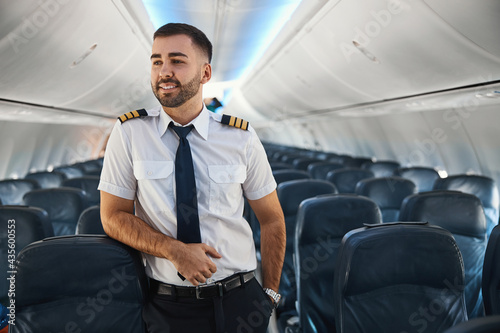 Photography Handsome contented pilot relaxing before the flight