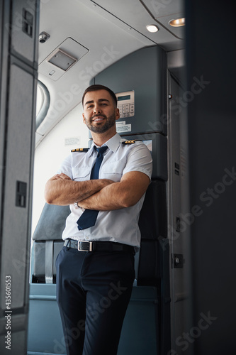Confident attractive airman in the plane alone © Viacheslav Yakobchuk