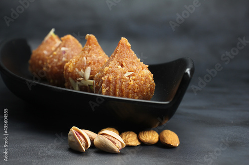 Besan ke ladoo or Motichur ke ladoo or Modak made from Chickpea flour,desi ghee and sugar during festival season like Diwali nad Ganesh chaturthi. photo