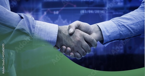 Mid section of two businessman shaking hands against digital interface and technology background
