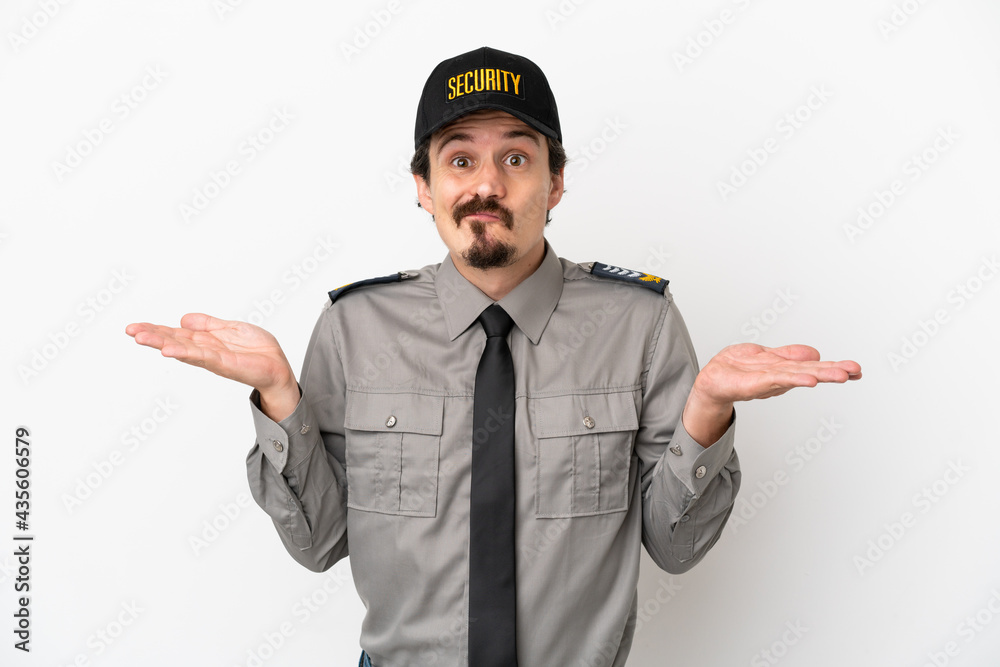 Young caucasian security man isolated on white background having doubts while raising hands Young caucasian security man isolated on white background having doubts while raising hands
