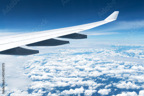 View of clouds and wing from a plane window