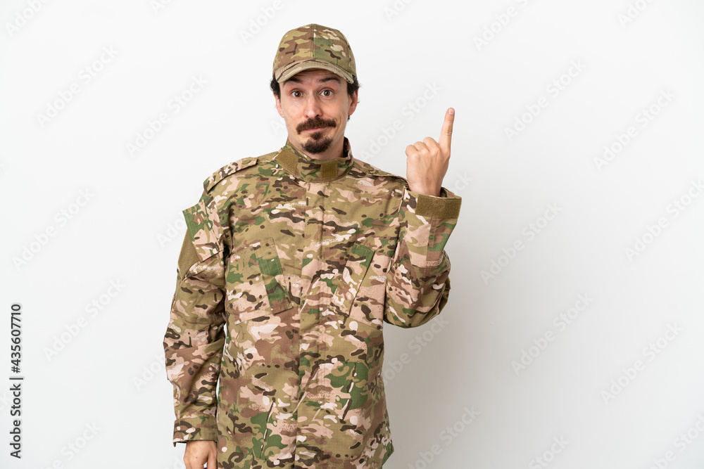 Soldier man isolated on white background pointing with the index finger a great idea Soldier man isolated on white background pointing with the index finger a great idea