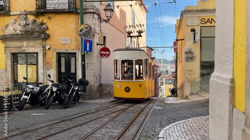 Lisbon Funicular Bica Lift Going Uphill, Slow Motion. The Bica Funicular is a funicular railway line in the municipality of Lisbon, Portugal. photo