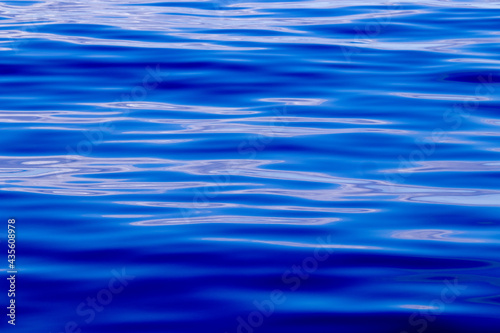 Blue pattern  waves of the ocean  calm sea  nature details.