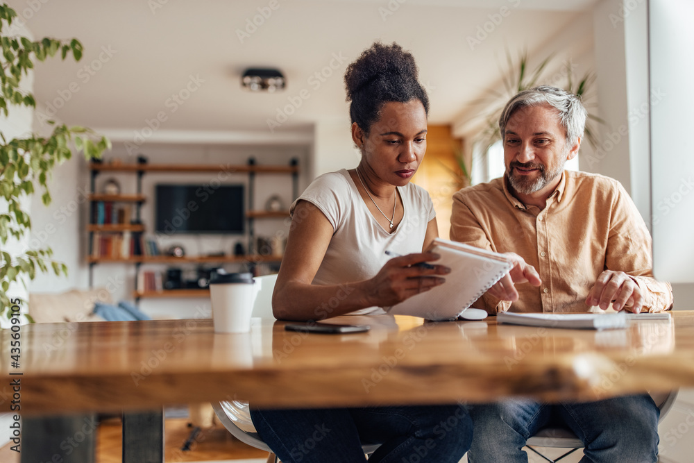 African wife explaining her business plan to her husband. African wife explaining her business plan to her husband.