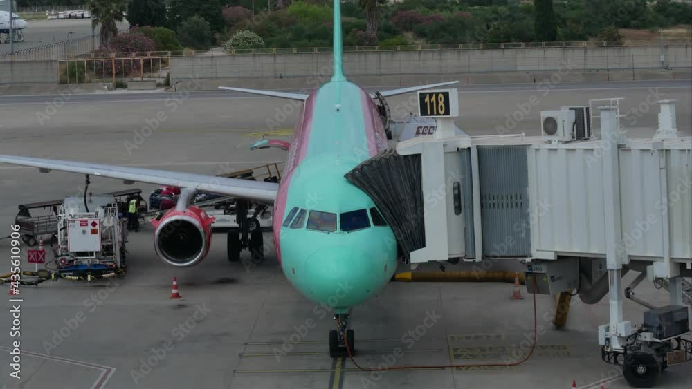 Time-lapse plane maintenance checking during refueling and loading baggage. Passenger Aircraft in the airport