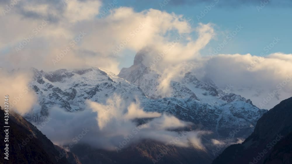 The Olan peak in the Ecrins National Park with passing clouds (time-lapse). Major peak of the GR54 Ecrins Massif hiking tour. Valgaudemar Valley in the
 Hautes-Alpes, French Alps, France