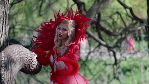 Wallpaper Mural creative image of medieval dame in red dress, fantasy and fairy tale concept, actress is walking in forest Torontodigital.ca