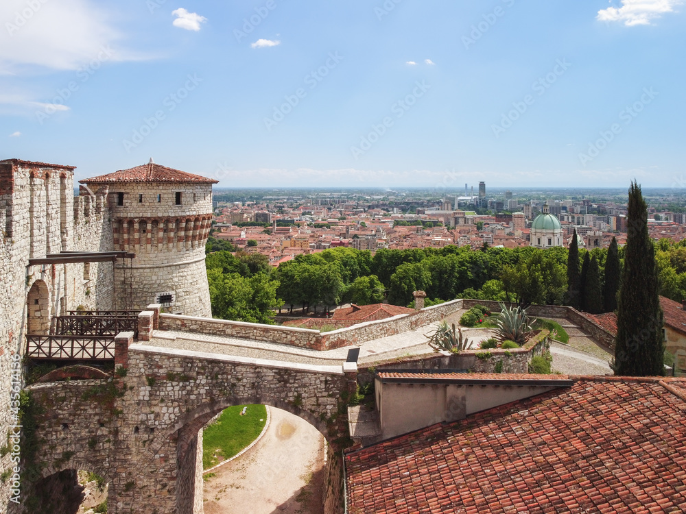 Beautiful view from a drone to the main entrance with a drawbridge to the medieval castle of Brescia city