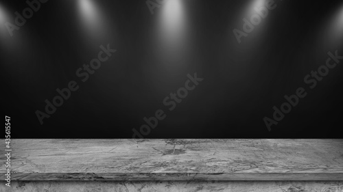 Stone table top on black wall background with spotlight. Use as montage for product display