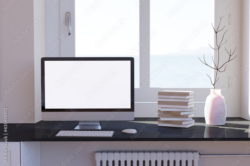 Obraz premium Blank computer desktop with keyboard on table at window, books on marble table in sunny room, mockup