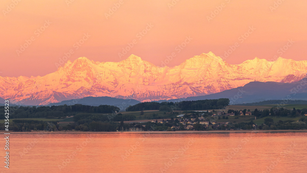 Eiger, Mönch and Jugfrau seen over lake from Neuchatel, Switzerland