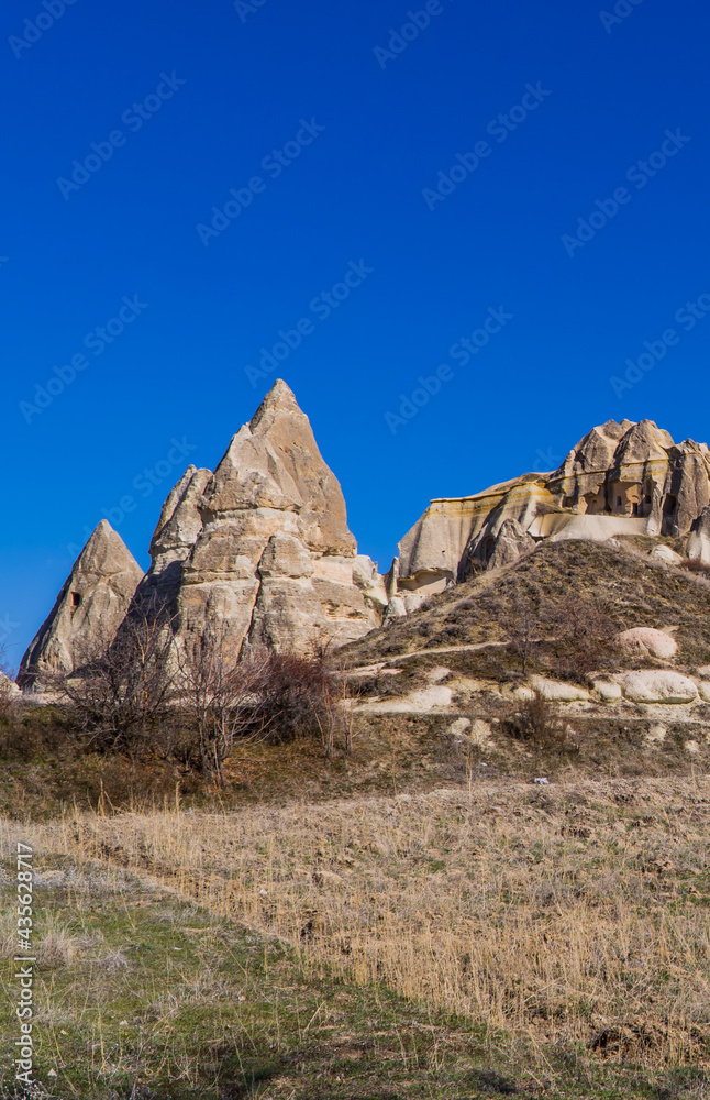 Vertical view of a field with typical rock formations and fairy chimneys in Cappadocia, Turkey Vertical view of a field with typical rock formations and fairy chimneys in Cappadocia, Turkey