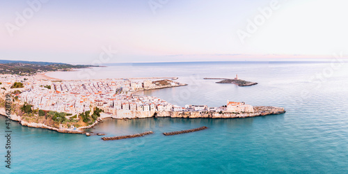 Aerial view of the white buildings of Vieste at sunrise, Foggia province, Gargano National Park, Apulia, Italy photo