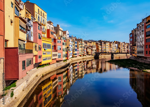 Colourful houses reflecting in the Onyar River, Girona (Gerona), Catalonia photo