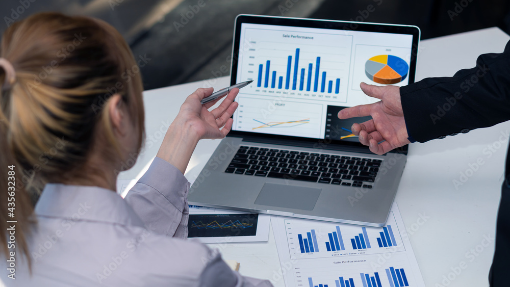 Businessman doing business in finance and calculations, analysis, graphs of investment costs, real estate and tax systems on their desks with laptops Businessman doing business in finance and calculations, analysis, graphs of investment costs, real estate and tax systems on their desks with laptops