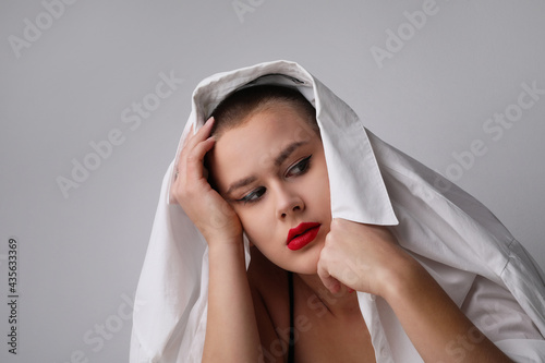 Portrait of young bald woman, posing in the studio. Isolated. photo