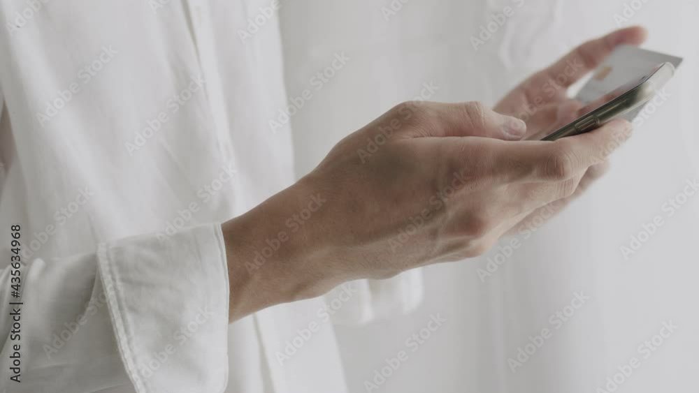 Close-up hands businessman using smartphone purchase online shopping while quarantining during COVID-19 pandemic. Shopping online concept.