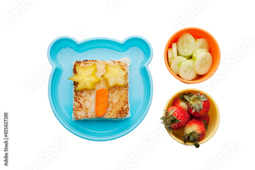 School lunch box snacks for kids over white background. Back to school. Healthy and fun snacks option for parents. Cute food art creative concepts. Bows with fruits and vegetables and cute sandwich.