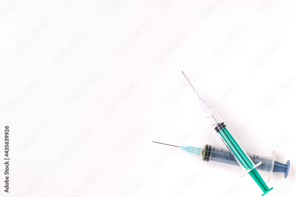Plastic Syringe isolated stock image on texture background. Plastic Syringe isolated stock image on texture background.