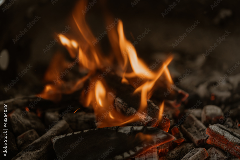 Barbecue Grill Pit With Glowing And Flaming Hot Charcoal Briquettes, Close-Up Barbecue Grill Pit With Glowing And Flaming Hot Charcoal Briquettes, Close-Up
