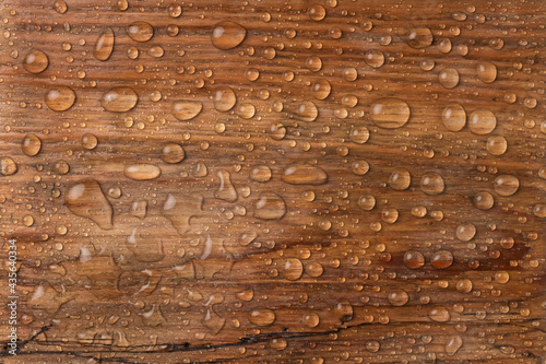 Beautiful old wooden surface, covered with raindrops. Beautiful background. Top view.