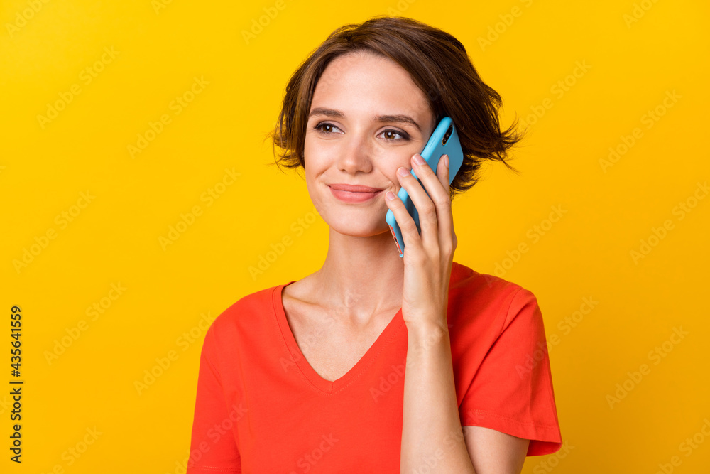 Photo of nice brunette sad lady talk telephone wear red t-shirt isolated on vivid yellow color background Photo of nice brunette sad lady talk telephone wear red t-shirt isolated on vivid yellow color background