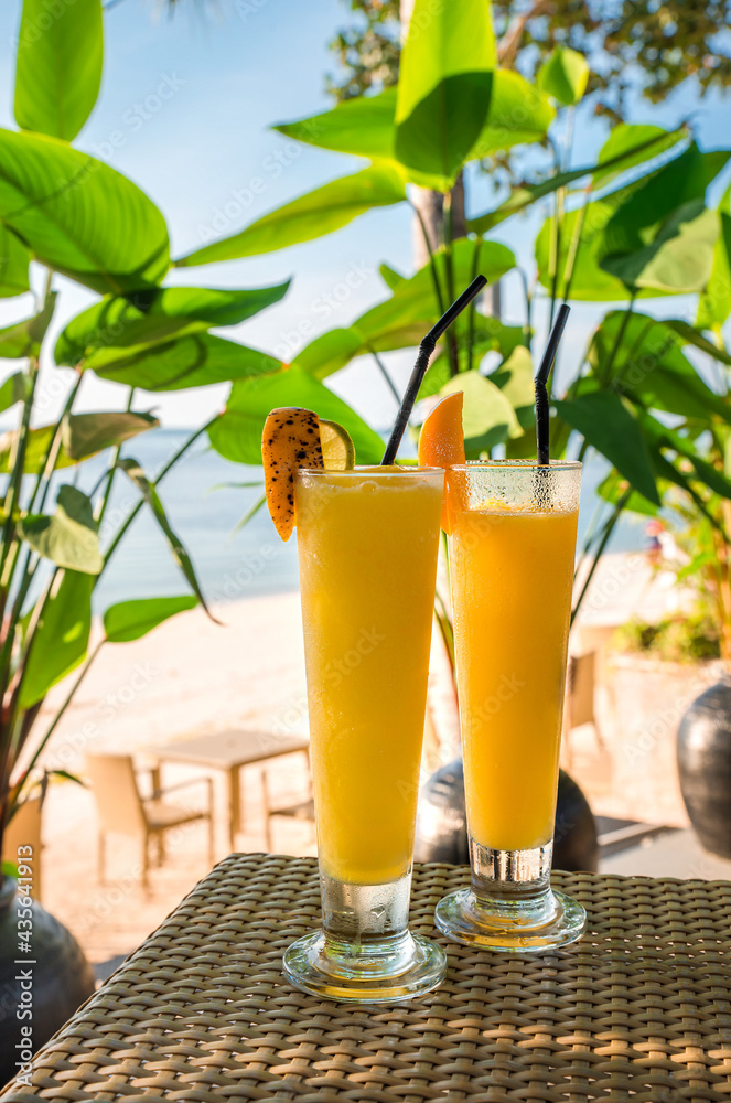 Cocktails or juice from fresh tropical fruits on the background of the sea. Cocktails or juice from fresh tropical fruits on the background of the sea.