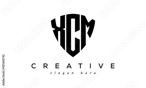 XCM letters creative logo with shield photo