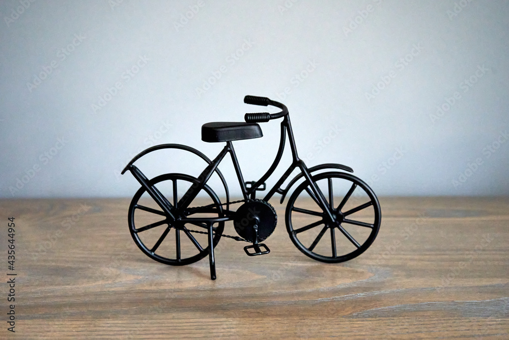 Metal figure black bicycle sideways