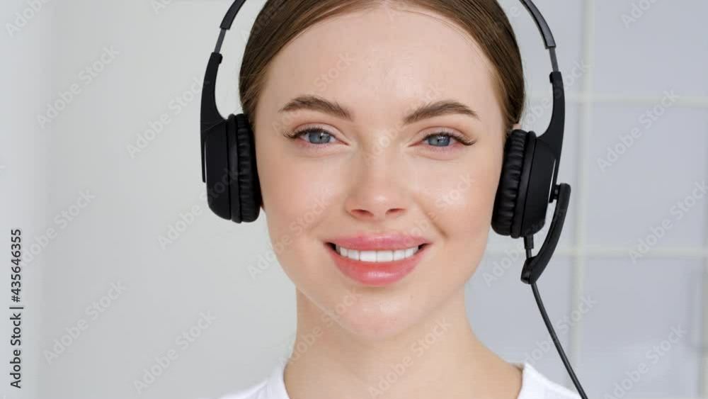 Call center operator woman close up face portrait headphones happy smile model Call center operator woman close up face portrait headphones happy smile model