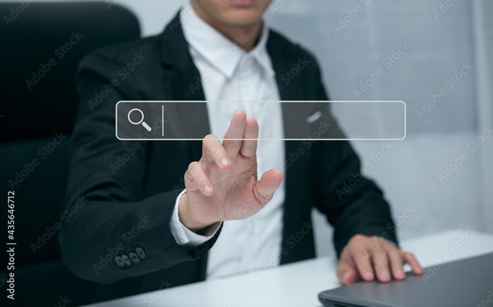 Asian businessman uses a job search Smart phone computer to search for information on his financial business Asian businessman uses a job search Smart phone computer to search for information on his financial business