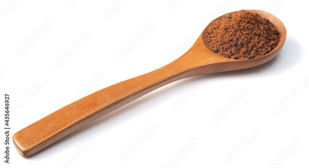 brown sugar in the wooden spoon, isolated on white background brown sugar in the wooden spoon, isolated on white background